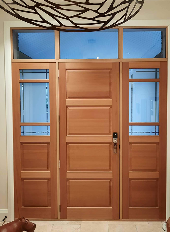 Wooden door with frosted sidelights and high-tech lock by Hoults Doors