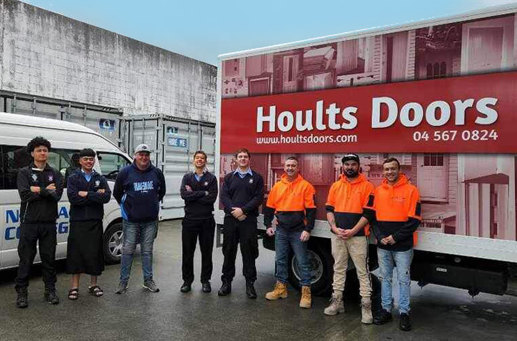 Hoults Doors van and staff next to players from Naenae College Rugby