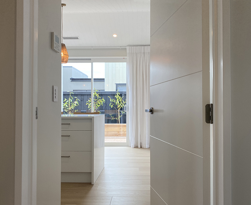 A contemporary white interior door, installed by Hoults Doors.